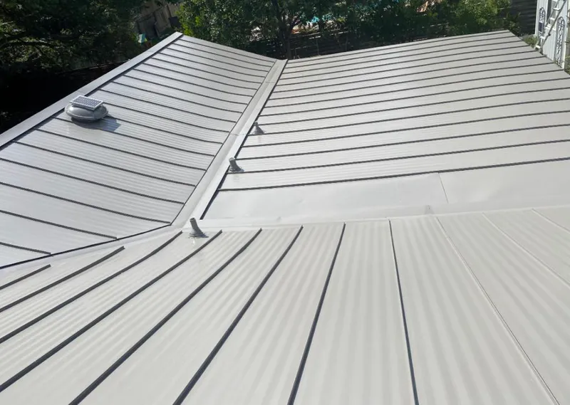 Solar attic fan installed on a metal roof for Roof Ventilation in Middle River